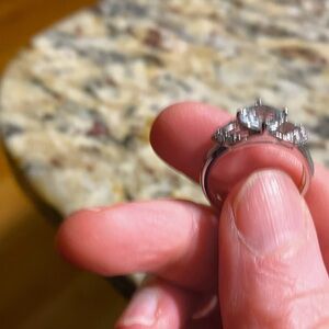 A silver gemstone ring